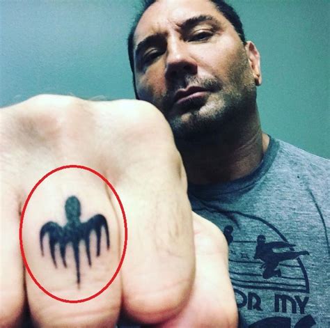 1.28 dave bautista's hand tattoos 1.29 angel and an owl tattoo Dave Bautista's 32 Tattoos & Their Meanings - Body Art Guru