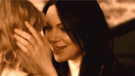 She plays with her favorite toy. Kiss Laura GIF - Kiss Laura Prepon - Discover & Share GIFs