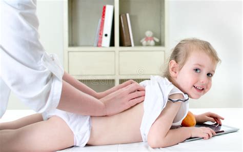 Select from premium gynecological examination of the highest quality. Masseuse Doing Massage To Little Girl Stock Photo - Image ...