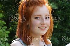 redhead red young girl pretty hair face ginger pale profile jeans skin looking freckles bob bra teenager standing happy garden
