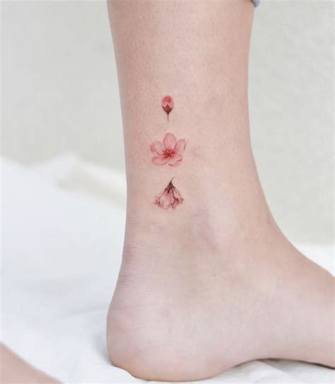 You can't help but love this tattoo. Cherry blossom tattoo in 2020 | Foot tattoos, Mini tattoos ...