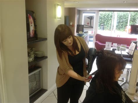 Begin drying the lower layers with a brush, using more heat. Graduate stylist Hannah blow drying curly hair straight ...