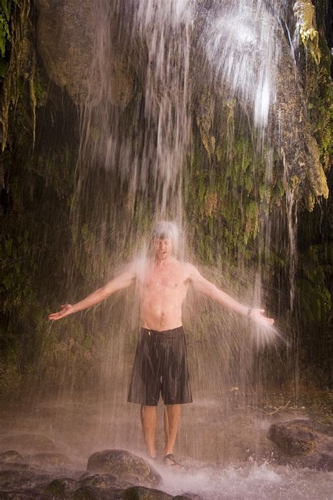 Fiancee receives smashed from underneath. A Man Enjoys A Shower Under A Waterfall Photograph by ...