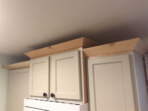 Painting laminate cabinets before and after lisa dco. Painting Kitchen Cabinets and DIY Cabinet Molding ...