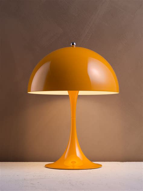 Panton's aim was to create a lamp in which the base and the shade would both act as reflectors. Panthella MINI by Louis Poulsen | Archello