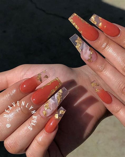 Burnt orange is a statement colour, which will compliment a variety of colour schemes, why not pair with a dark grey to create a contrasting style. 40 Beautiful Nail Design Ideas To Wear In Fall : Burnt orange and gold foil