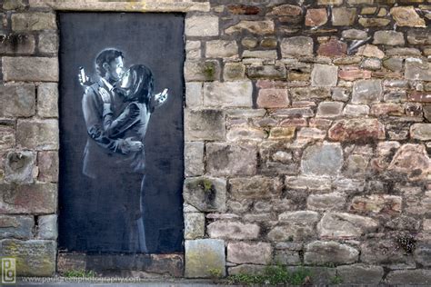 Banksy's political statements and disruptive vision have impacted cities across the globe at vital at the age of 18, banksy was nearly caught vandalizing public spaces by police. Banksy Gives Controversial Mobile Lovers Artwork to ...