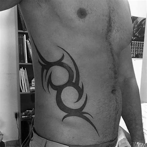 64 rib tattoos that will make you want to show your sides. Top 40 Best Tribal Rib Tattoos For Men - Manly Ink Design ...