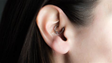 Piercing (countable and uncountable, plural piercings). Do daith piercings really help with migraines?