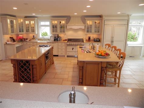 A colorful mix of ceramic, glass and stone tiles, stained glass windows, updated cabinets and an open floor plan rejuvenate a cramped, unappealing kitchen space. Customize your kitchen convenience - Cabinets by Graber