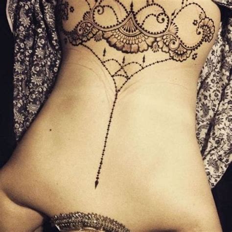 To create a front hand henna design like this one, pinpoint the center of the palm (or close enough to the center) and start with a dot, a circle, a spiral, a flower, a star, any symbol or image that you like. Best Henna Tattoos for Back: Bold and Beautiful Designs ...