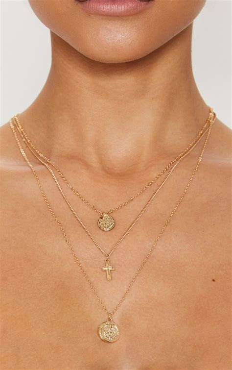 Our gold oglala layered pendant necklace features the icarus wing as a reminder to nourish your spirit, enjoy the freedom of the journey, and to soar. Gold Renaissance Mini Coin Cross Layered Necklace | Layered necklaces, Delicate necklace, Coin ...