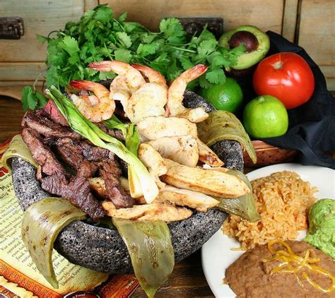 There's something about that roasted salsa, combined with the melted cheese and warm tamal that made this so delicious. The Molcajete (With images)