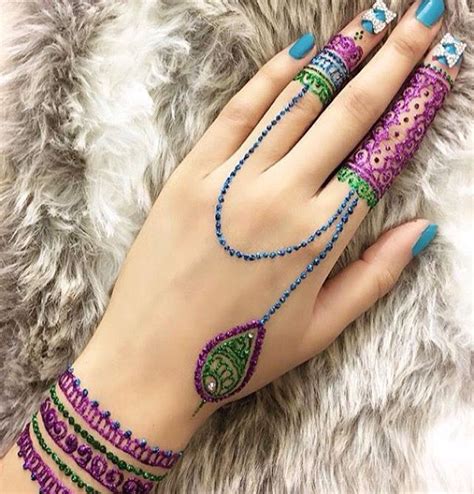 It symbolizes purity and the unity of one's soul with the divine. Colored Henna Tattoo Designs | Latest Mehandi Design ...