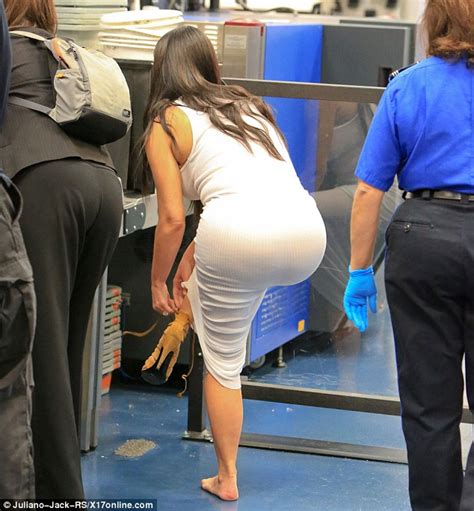 Her agency described her as 5 feet 3 inches. Kim Kardashian takes off her heels as she goes through ...