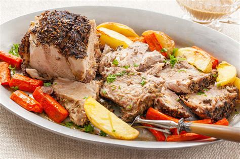 The oven temperature is reduced for the remainder of the this version uses leaner pork loin as the central meat. Bone In Pork Shoulder Roast Recipe Oven With Potatoes And Carrots - Image Of Food Recipe