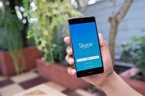 Skype for android is an application that provides video chat and voice call services. CHIANG MAI, THAILAND - August 05,2018: Man Holding HUAWEI ...