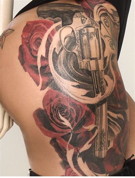 There is a tattoo of a silhouette of a girl, dancing in front of a blue cloud in the middle part of slash's back. Pin on tattos....
