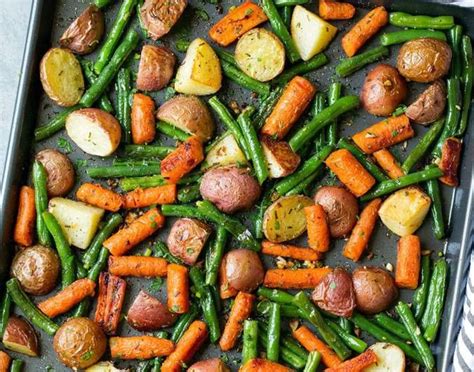 Return to oven and roast until all of the veggies are tender and slightly. Garlic Herb Roasted Potatoes Carrots and Green Beans ...