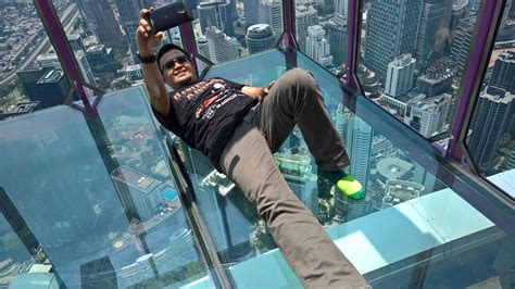 At 300 meters up, the sky box extends out from the sky deck ledge. KL Tower Sky box