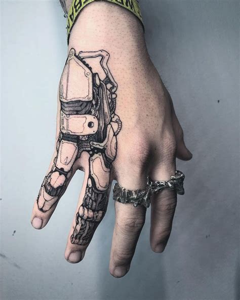 There are ten fingers on hand and you can get each knuckle inked with a unique popular tattoo design ranging from heart tattoo to butterfly tattoo. Mechanical Hand Tattoo