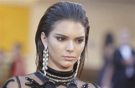 Kendall Jenner flashes her nipple piercings again in ...