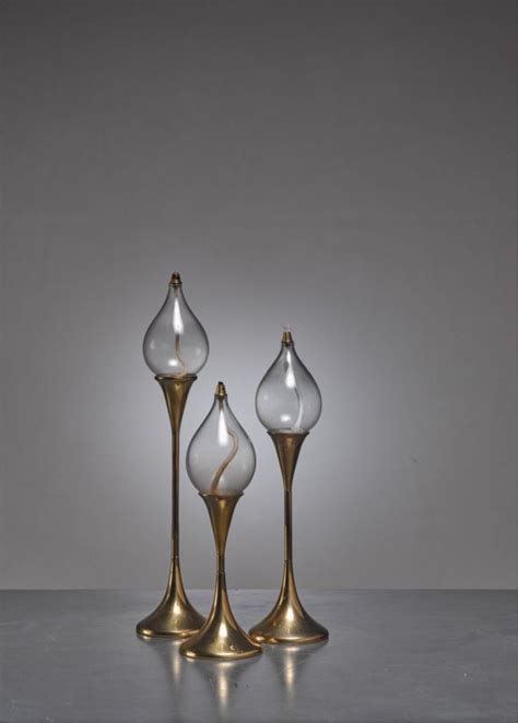 Find a collection of paintings, prints. Set of three brass oil lamps or candle holders, Denmark