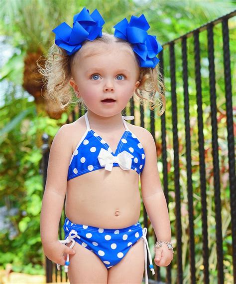 Empty the tub after bath time is over. Love this Babi-Kini Blue & White Polka Dot Bikini - Infant ...