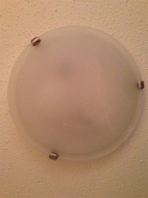 To remove the cover of most florescent light fixtures, simply locate and unscrew the screws holding the frame in place. lighting - How can I change the bulb in this three-clawed ...