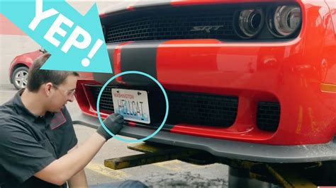 I do see two little circles marked, i'm guessing that is where the factory bracket goes,. Dodge Challenger License Plate Holder Install - YouTube