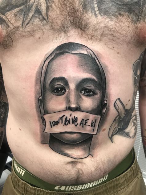 Eminem got this tattoo as a mark of respect for his uncle, ronnie pilkington, who upper right arm tattoo : Eminem tattoo by colin Woolford | Eminem tattoo, Tattoos ...