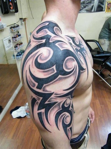This creative floral design looks amazing when it comes to a feminine design. 150+ Best Shoulder Tattoos For Men (2021) Tribal Designs ...