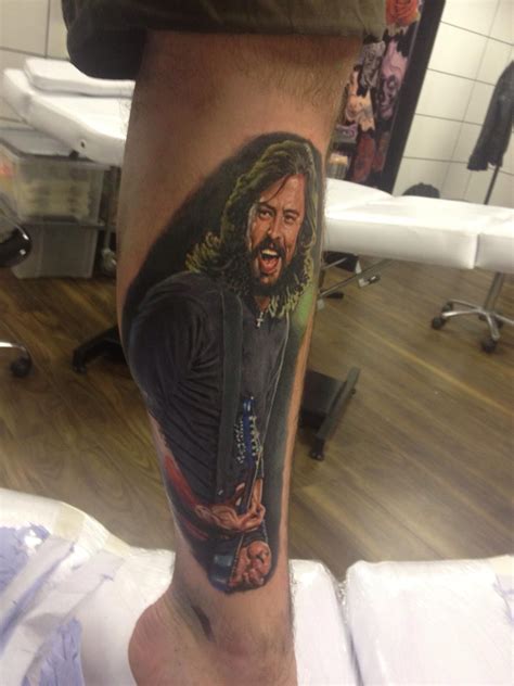 His left and balances the two, the large feathers tattooed on both forearms gently rising and falling. Dave Grohl tattoo | Dave grohl tattoo, Dave grohl, Foo ...