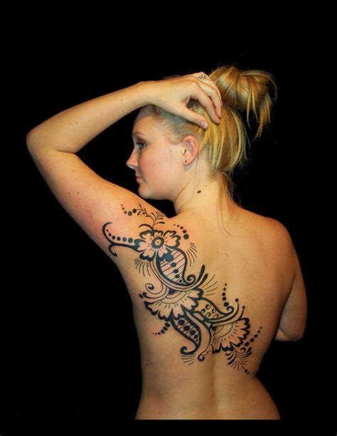 Boy making tattoo on girls breast bodysubscribe to my channel : allentryfashionupdates: Henna Flowers Tattoos 2012