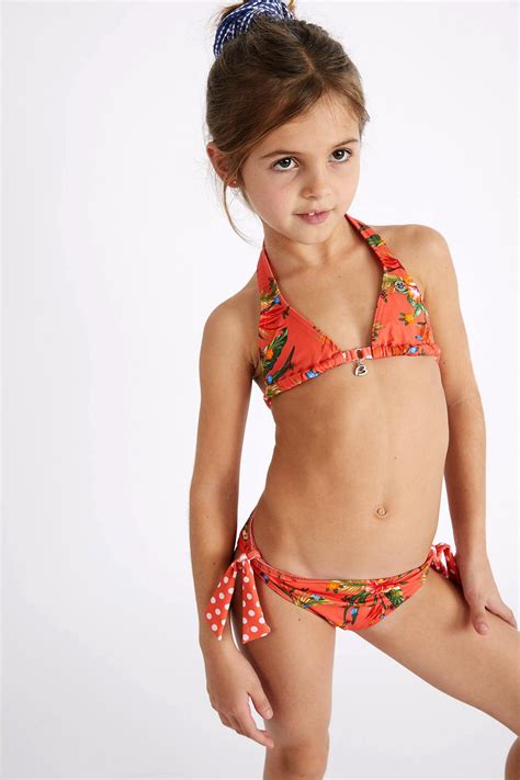 The girls born in 1986, have started off singing and performing individually at a young age. M PAWN DOLCEVITA girls' two-piece orange floral print swimsuit