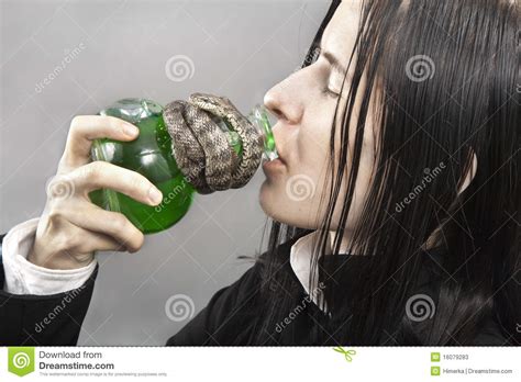 The Person Drinks Poison From A Flask Stock Image - Image: 16079283