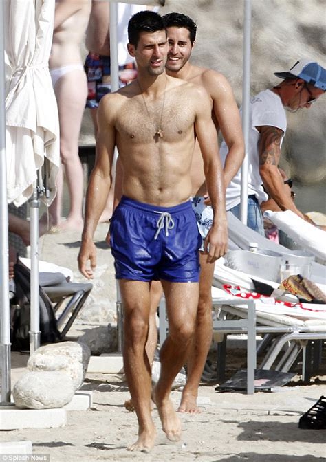 Zdobywca trofeum w 2010 roku; Novak Djokovic takes a dip in the Med on stag do in Ibiza ...