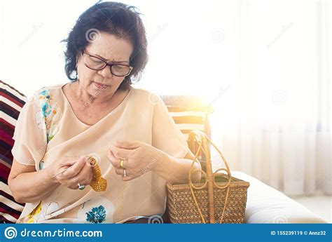 Whether you are looking for a unique gift, clothing, jewelry or home decor, this is the perfect moment to celebrate asian american and pacific islander sellers. Asian Old Woman Is Knitting Crochet In Room With Copyspace ...