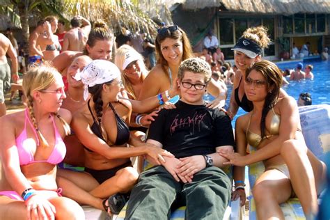 Spring is in the air! 2002: Jack Osbourne is surrounded by bikini-clad ladies in ...