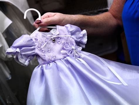 .woman transforming wedding dresses into burial gowns for stillborn and miscarried children. These Women Make Tiny Gowns for Grieving Parents | Angel ...