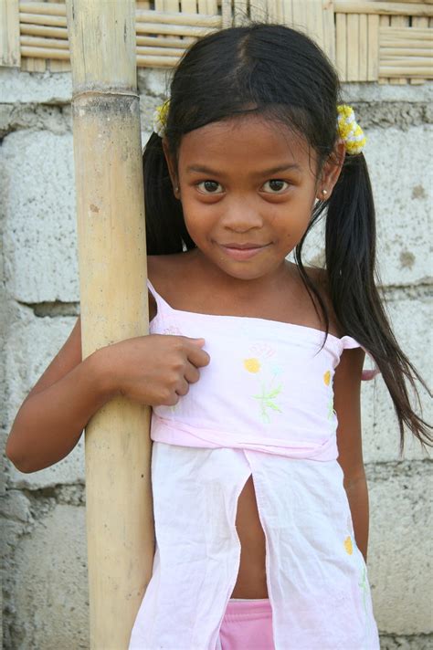Elegant attractive child with a slender body and bare long legs. Asia - Philippines / Luzzon - preteen Philippine girl - a ...