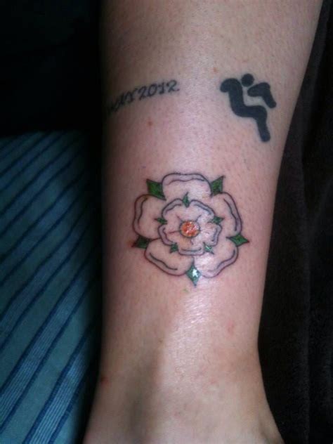 It's still pretty new in the photo, hence the redness. The Yorkshire Rose - outside right ankle, marking ...