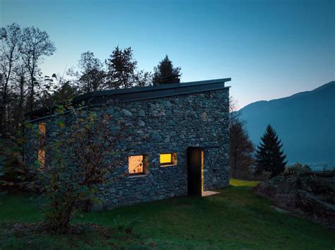 Stone house by chrofi architects is the alteration to a single story vernacular house in the rural landscape setting of northern new south wales, australia. Modern Stone Cabin in Northern Italy is a Romantic Gem