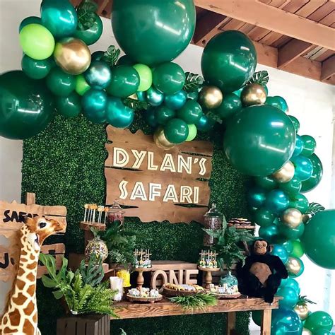 The centerpiece is made of a shiny metallic material that glistens and shines as it sways in the light. Pin on Jungle First Birthday Party Ideas Outfit and ...