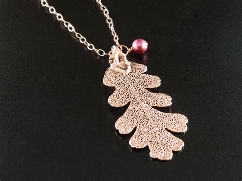 Early stages skeletonize leaves, mature larvae eat leaves from margins to veins, leaving only veins behind. Rose Gold Oak Leaf on 20 inch Chain Necklace, Real Leaf ...