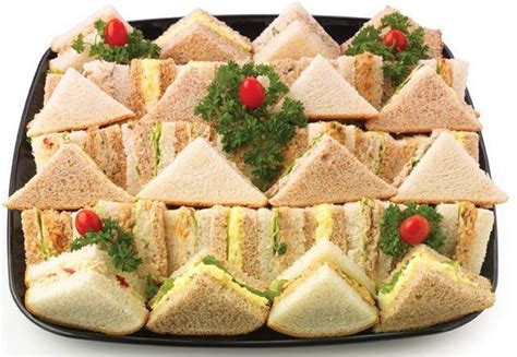 For the baby shower, we offered cheese burger sliders, mini hots dogs, tiny hummus sandwiches, s'mores pops, itty bitty cheese squares, granola bar use a bread knife to slice the crusts off each side of the sandwiches then carefully cut each sandwich into quarters lengthwise, making little finger. Image result for Easy Baby Shower Finger Sandwiches | Baby ...