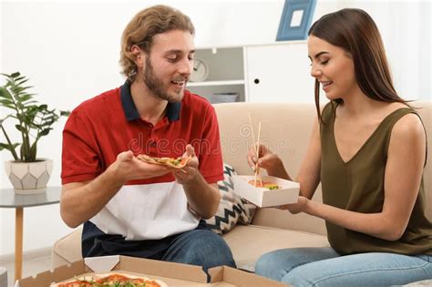 Maybe you would like to learn more about one of these? Young Couple Having Lunch In Living Room. Stock Image ...