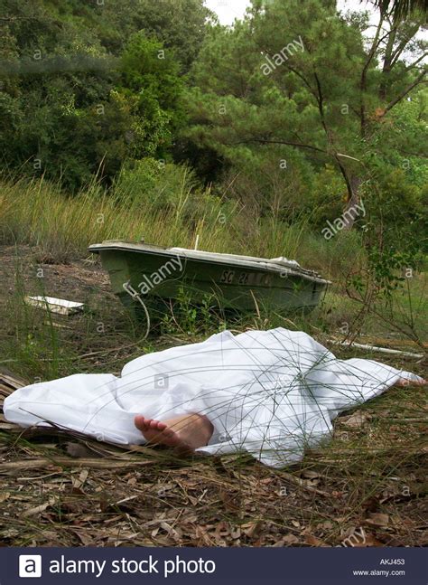 It appeared that they had been unloading groceries at the time of the shooting. Foot of Caucasian Female Dead Body Protruding from Under White Sheet Stock Photo: 2778194 - Alamy