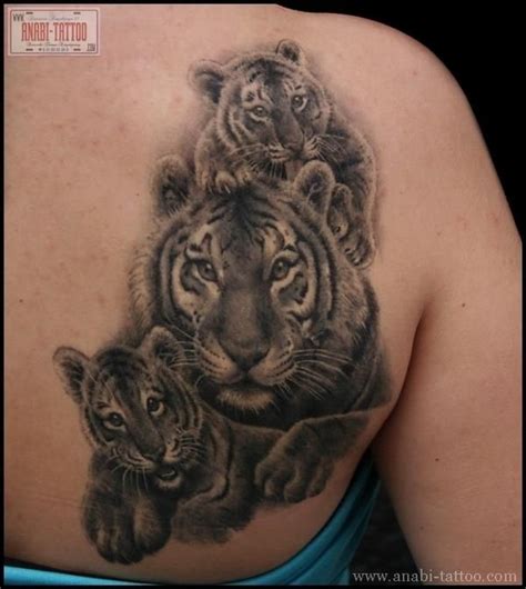 Blue eyes white tiger tattoo on forearm. Tiger & mom twist ~tattoo by Anabi Tattoo i'm not a tiger ...