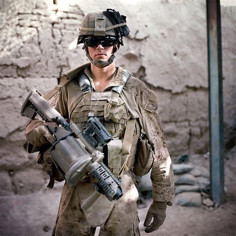 US Marine of 1st Battalion, 5th Marine Regiment with an M32 Multiple ...